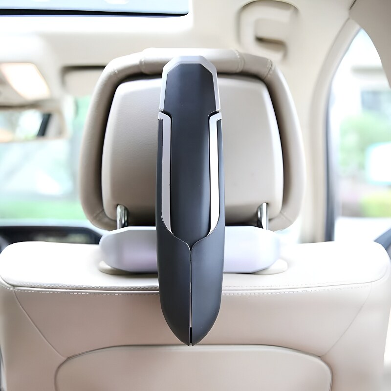 Car headrest hanger installed on seat back
